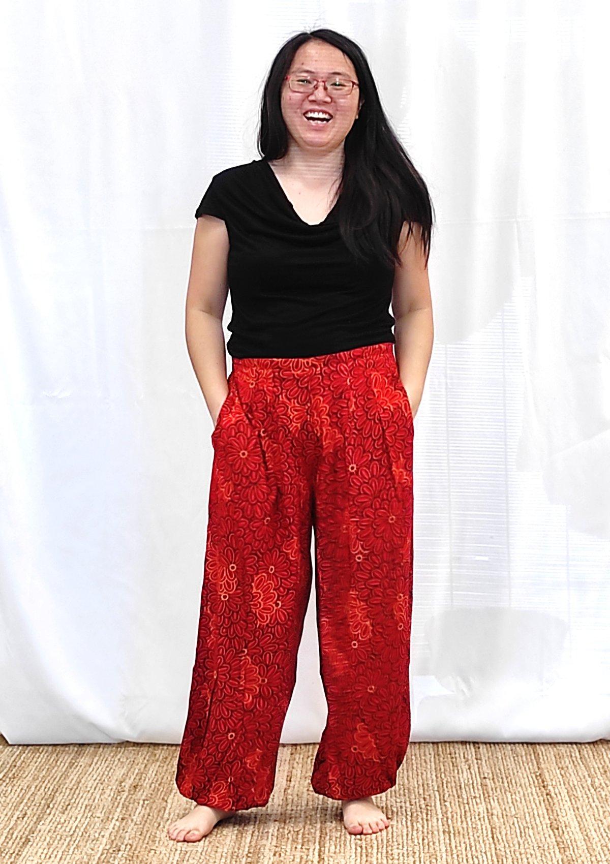 Pantalon femme bouffant fleuri orange